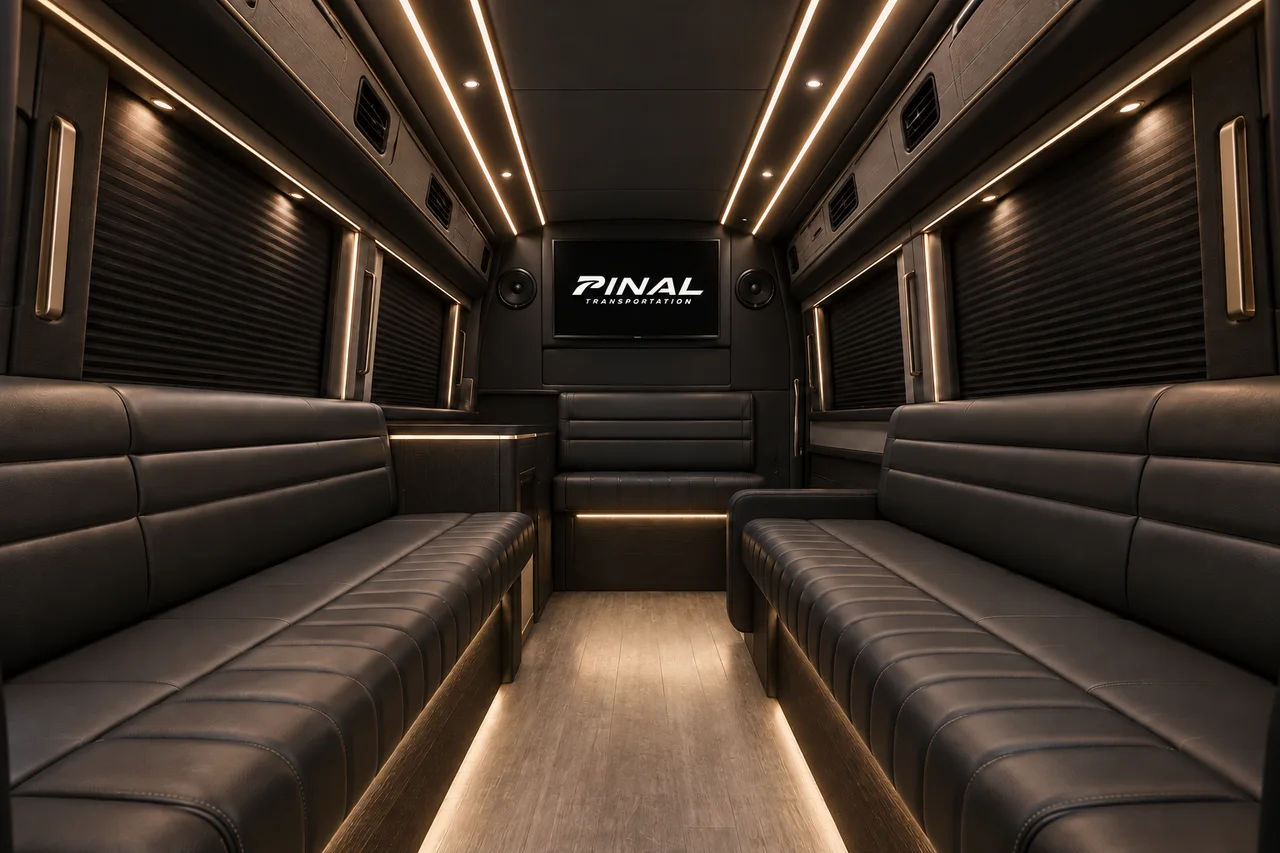 AI-generated Sprinter lounge concept with charcoal benches, warm lighting and the italic Pinal Transportation logo on the front screen.